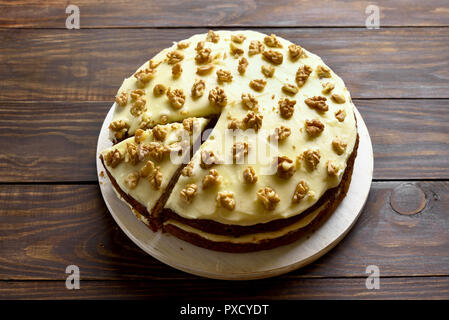 Tasty carrot cake on wooden table. Healthy homemade baking. Stock Photo