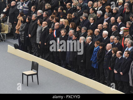November 27, 2015 - Paris, France: France holds a national ceremony to pay homage to the 130 people killed in the November 13 attacks. The tribute took place in presence of French president Francois Hollande, members of the government and prominent French politicians, members of rescue, military and police services. The next president, Emmanuel Macron, is visible on the extreme right of the group. Ceremonie d'hommage national aux victimes des attentats du 13 novembre 2015, dans le cadre des Invalides a Paris. *** FRANCE OUT / NO SALES TO FRENCH MEDIA *** Stock Photo
