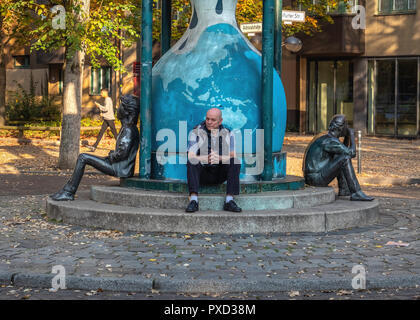 Double admiral bronze sculpture by Ludmila Seefried-Matejková. An hourglass topped with a mirror image of Admiral Adalbert & two young bronze figures  Stock Photo