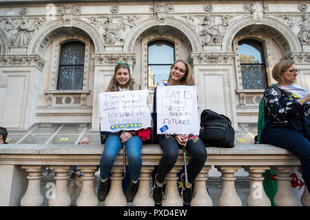 Two teenagers pose with placards during the People's Vote march on Whitehall, London. Stock Photo