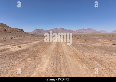 Typical dirt road in remote valley east of Murghab, Murghab District, Pamir Mountains, Gorno Badakhshan Autonomous Region, Tajikistan