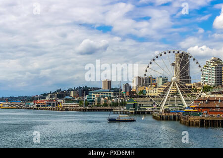 Great or Ferris Wheel and waterfront of Seattle from Elliott Bay. Seattle Skyline. Stock Photo