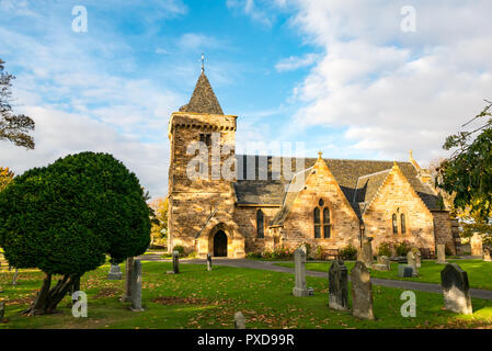 Aberlady Parish Church lit by evening sun with blue sky, East Lothian, Scotland, UK Stock Photo