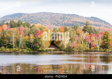 A view of the brilliant and eclectic colors that take over the entire Adirondacks region in New York state of USA during the peak fall season