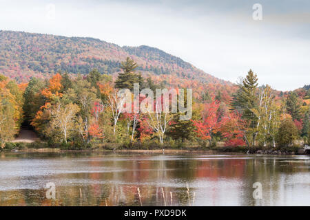 A view of the brilliant and eclectic colors that take over the entire Adirondacks region in New York state of USA during the peak fall season