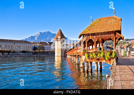 Kapellbrucke historic wooden bridge in Luzern and waterfront landmarks view, town in central Switzerland Stock Photo