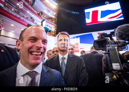 © Chris Bull. 3/10/18  BIRMINGHAM    , UK.    Closing day of the Conservative Party conference at the The International Convention Centre in Birmingham , England, today (Wednesday 3rd October 2018).  Prime Minister Theresa May delivers her closing speech to the conference. Cabinet members take their seats. L-R  Dominic Raab MP and Jeremy Hunt MP with Sajid Javid MP (back left) and Philip Hammond (back right) pictured in the background. Photo credit: CHRIS BULL Stock Photo