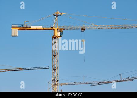 Tall Construction Cranes Stock Photo