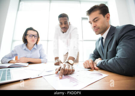 Business colleagues analyzing sales data Stock Photo