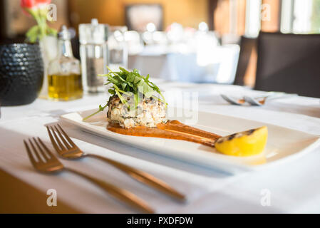 Crab dish with garnish and lemon Stock Photo