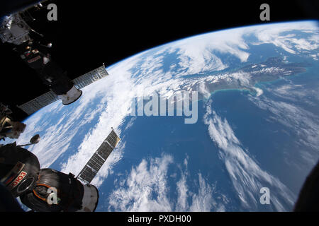 Two Russian spacecraft, the Soyuz MS-09 crew ship, foreground, and the Progress 70 resupply ship, are pictured docked to the International Space Station as the complex orbits nearly 262 miles above New Zealand September 18, 2018 in Earth Orbit. Stock Photo