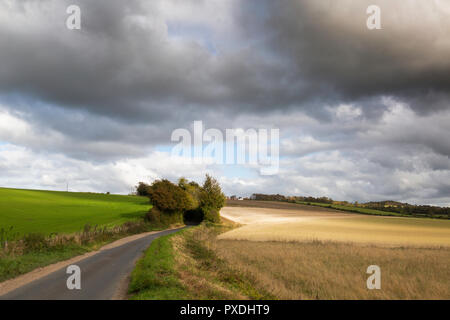 Dramatic light over the undulating fields of the Chartham Downs, part of the North Kent Downs, at Mystole near Canterbury, Kent, UK. Stock Photo