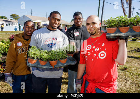 Miami Florida,Liberty City,Square,public housing,neighborhood,volunteer volunteers volunteering work worker workers,working together serving help,help Stock Photo