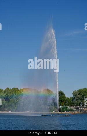 waterfountain on the Alster in Hamburg, including a rainbow Stock Photo