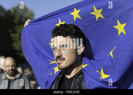 London, Greater London, UK. 20th Oct, 2018. A protester seen holding a EU flag during the march.A huge demonstration organised by the People's vote campaign gathered at Park Lane to march to the Parliament Square to protest against the Tory government's Brexit negotiations and demanding for a second vote on the final Brexit deal. Credit: Andres Pantoja/SOPA Images/ZUMA Wire/Alamy Live News