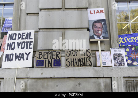 London, Greater London, UK. 20th Oct, 2018. Placards are seen at the Cabinet office building during the march.A huge demonstration organised by the People's vote campaign gathered at Park Lane to march to the Parliament Square to protest against the Tory government's Brexit negotiations and demanding for a second vote on the final Brexit deal. Credit: Andres Pantoja/SOPA Images/ZUMA Wire/Alamy Live News