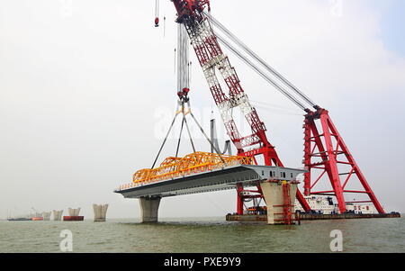 (181022) -- ZHUHAI, Oct. 22, 2018 (Xinhua) -- Photo taken on Jan. 19, 2014 shows the construction site of the Hong Kong-Zhuhai-Macao Bridge in the Lingdingyang waters, south China. The Hong Kong-Zhuhai-Macao Bridge is to be officially open to traffic at 9 a.m. on Oct. 24.  The 55-kilometer-long bridge, situated in the Lingdingyang waters of the Pearl River Estuary, will be the world's longest sea bridge. The construction began on Dec. 15, 2009.     It will slash the travel time between Hong Kong and Zhuhai from three hours to just 30 minutes, further integrating the cities in the Pearl River D Stock Photo