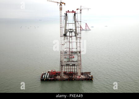 (181022) -- ZHUHAI, Oct. 22, 2018 (Xinhua) -- Photo taken on Feb. 23, 2015 shows the construction site of the Hong Kong-Zhuhai-Macao Bridge in the Lingdingyang waters, south China. The Hong Kong-Zhuhai-Macao Bridge is to be officially open to traffic at 9 a.m. on Oct. 24.  The 55-kilometer-long bridge, situated in the Lingdingyang waters of the Pearl River Estuary, will be the world's longest sea bridge. The construction began on Dec. 15, 2009.     It will slash the travel time between Hong Kong and Zhuhai from three hours to just 30 minutes, further integrating the cities in the Pearl River D Stock Photo