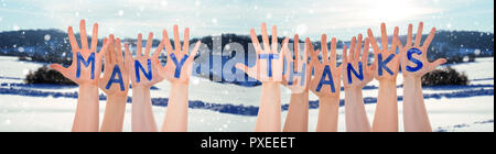 Many Hands Building Many Thanks, Winter Scenery As Background Stock Photo