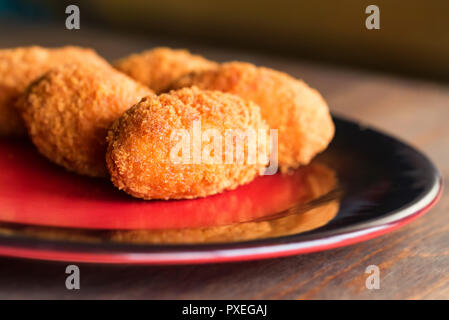 Freshly cooked breaded meat cutlets on plate Stock Photo
