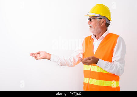 Profile view of handsome senior bearded man construction worker  Stock Photo