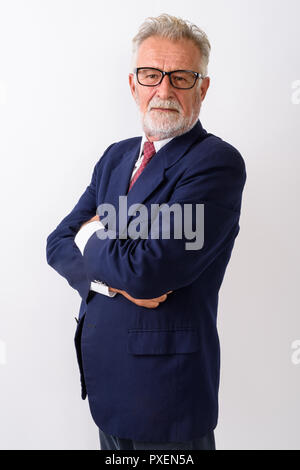 Studio shot of handsome senior bearded businessman standing with Stock Photo