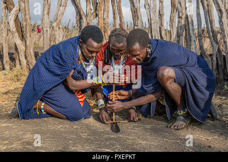 Maasai fire making at Ngorongoro Crater in Tanzania Stock Photo