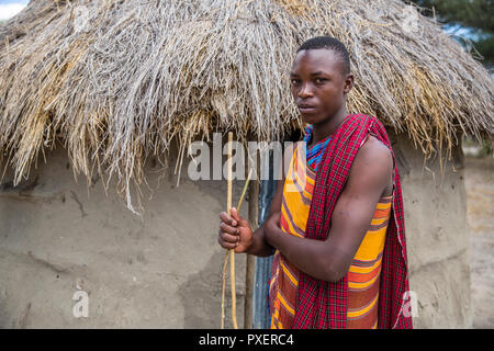 Maasai boy at hut in Tarangire National Park, Tanzania Stock Photo