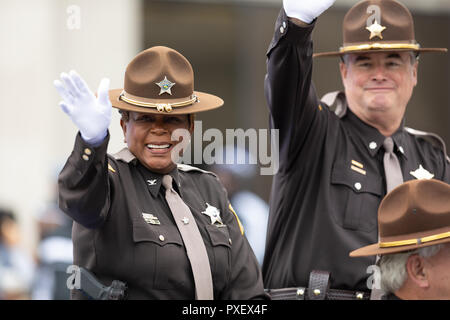 Indianapolis, Indiana, USA - September 22, 2018: The Circle City Classic Parade, Police Officers wave at the camera as they drive by at the parade Stock Photo