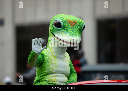 Indianapolis, Indiana, USA - September 22, 2018: The Circle City Classic Parade, Man wearing the Geico Gecko insurance mascot outfit Stock Photo