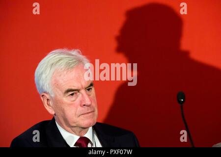 © Chris Bull. 23/9/18   LIVERPOOL   , UK.   The Labour Party Conference today (Sunday 23rd Septeber 2018). Fringe event - Real Britain : Where People Have a Voice. Pictured is John McDonnell, Shadow Chancellor of the Exchequer while  Len McCluskey , Unite General Secretary , makes his speech. The shadow of Len McCluskey can be seen behind John McDonnell. Len McCluskey , Unite General Secretary and John McDonnell, Shadow Chancellor of the Exchequer , share the stage. Len McCluskey has said today that if there has to be a referendum, voters should just get a choice between leaving the EU without Stock Photo