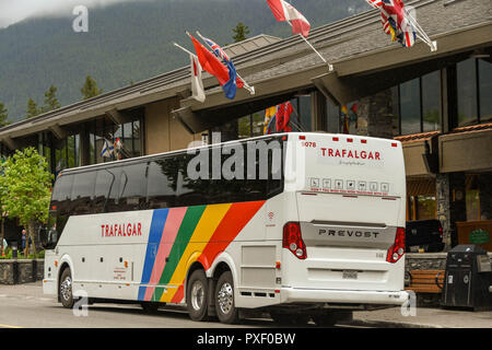 BANFF, AB, CANADA - JUNE 2018: Sightseeing tour bus parked outside a hotel in Banff. Stock Photo