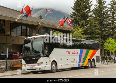BANFF, AB, CANADA - JUNE 2018: Sightseeing tour bus parked outside a hotel in Banff. Stock Photo