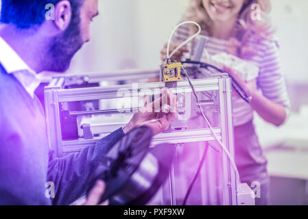 Bearded programmer feeling excited while working on developing new software Stock Photo