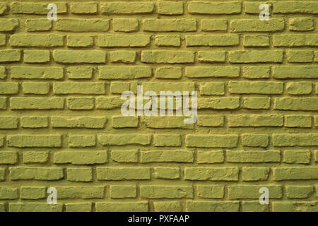 Olive Green Colored Rough Brick Wall at La Boca Neighborhood in Buenos Aires of Argentina, for Background or Banner Stock Photo