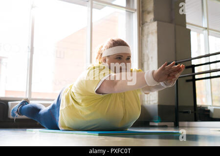 Obese Young Woman Working Out Stock Photo