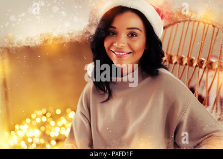 Beautiful woman wearing New year hat smiling broadly before celebration Stock Photo