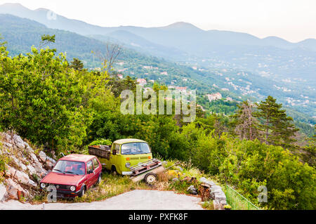 Lovran, Croatia - June 19, 2014: Old Volkswagen cars resting on a scenic spot during the retirement after a long life on the road. Now they have peace Stock Photo