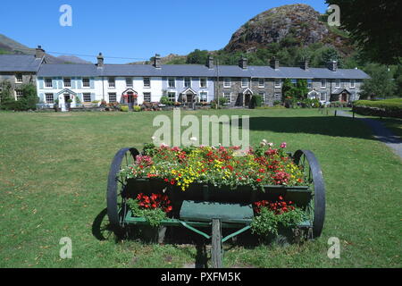 Row of terraced cottages behind the village green, Beddgelert, Gwynedd, Snowdonia, North Wales Stock Photo