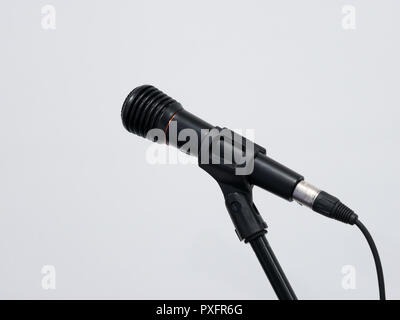 Wired black microphone on stand at white background Stock Photo