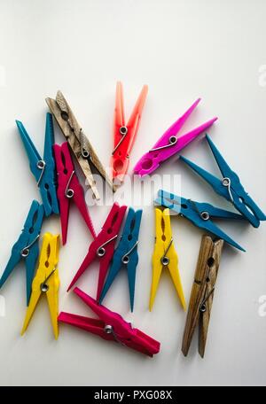 A Selection of Clothes Pegs on a white background Stock Photo