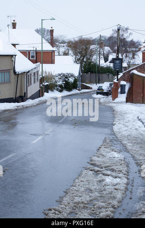 Suburban road on a snowy day Stock Photo