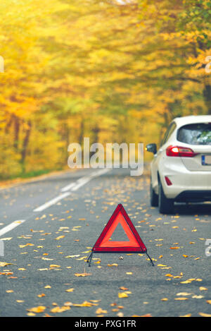 Broken car concept, breakdown triangle on road Stock Photo