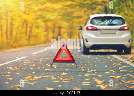 Broken car concept, breakdown triangle on road Stock Photo