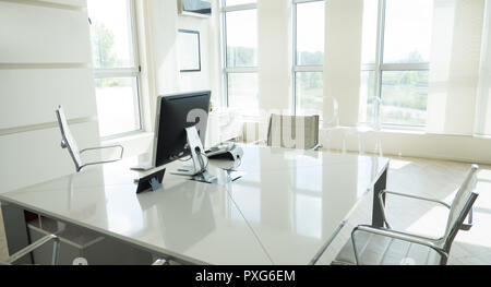 Modern empty elegant office with windows and workplaces Stock Photo