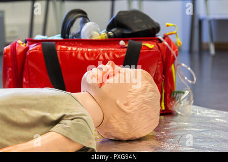 Medical teenager puppet lies injured on the ground Stock Photo - Alamy