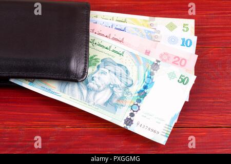 Tunisian money in the black wallet Stock Photo