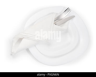 Place setting. Stainless fork and knife in white napkin on white plate. Top view isolated on white, clipping path included Stock Photo