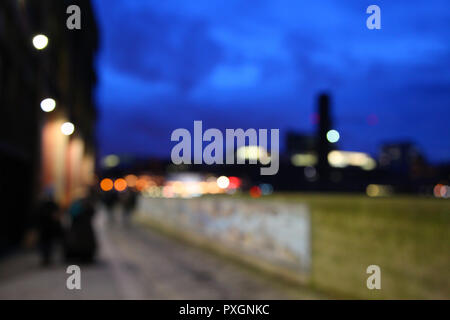 City of London/England - January 23 2016: Defocused image taken at night of lights along mosaic wall in street by Queenhithe Dock London Stock Photo