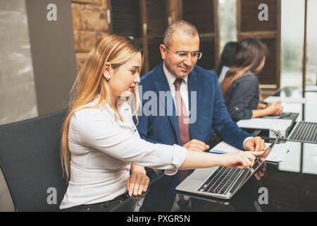 Creative business people working on business project in office. Stock Photo